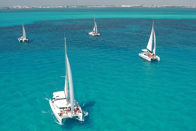 All-Inclusive Isla Mujeres Catamaran with Free Transportation - The onboard start: mimosa, safety briefing, and a real open bar