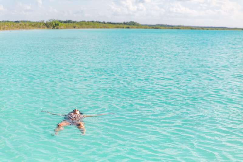 Bacalar: Group Sailing Trip with Swimming and Drinks - Cenote Negro and the sail segments between the big moments