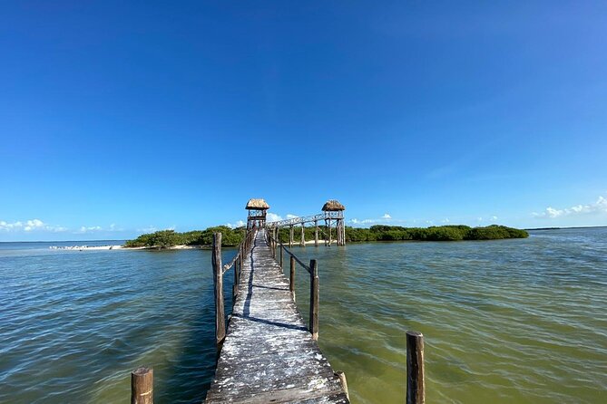 Boat Tour of Three Islands in Holbox with Transportation - Stop 1: Yalahau Lagoon and Ojo de Agua Fresh-Water Cenote