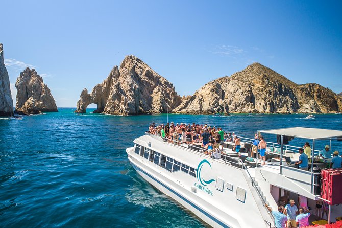 Cabo Sunset Dinner Cruise with Live Music & Open Bar on Cabo Wave - The 5 pm boarding vibe: upper deck first, dinner later