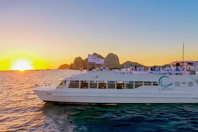 Cabo Sunset Dinner Cruise with Live Music & Open Bar on Cabo Wave - Playa de los Amantes: colorful Pacific sunset from an open-air deck