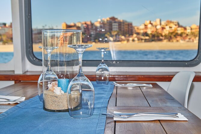 Cabo Sunset Dinner Cruise with Live Music & Open Bar on Cabo Wave - Cabo San Lucas Beach dinner: Mexican-style meal, oversized windows, and drinks