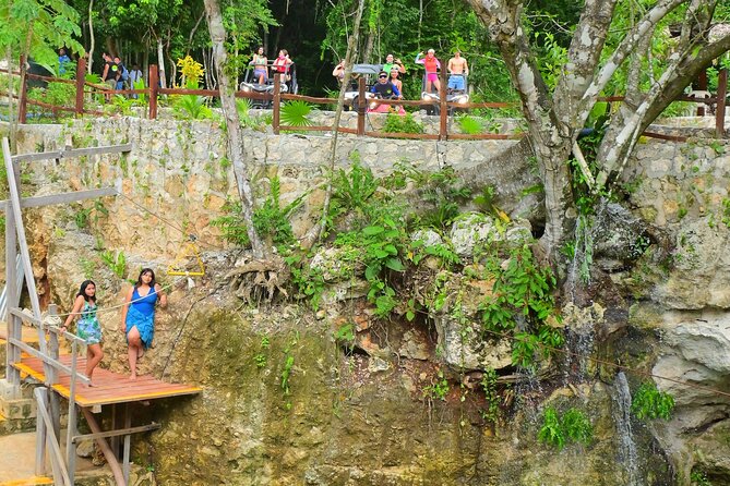 Cancun ATV Tour with Zipline, Cenote & Transportation - Cenote swim and jumping platform: bring water-ready shoes