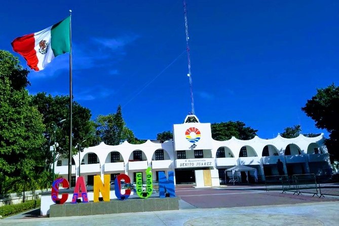 Cancun City Sightseeing and Shopping Tour on a Double Decker bus - Playa Delfines and the Cancun sign photo (weather can change it)