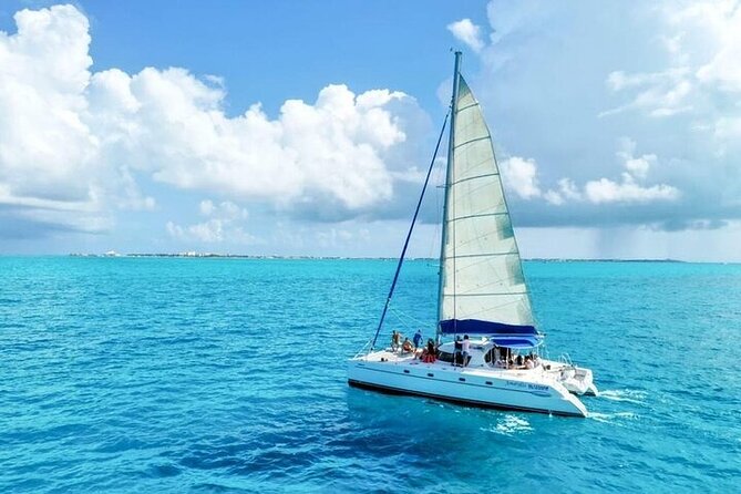 Cancun's Best: Catamaran to Isla Mujeres, Snorkeling & Drinks! - Boarding in Cancun: Open Bar, Live Music, and the Party Tempo