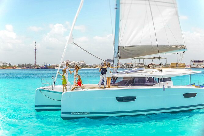 Catamaran to Isla Mujeres Snorkeling Tour with Open Bar and Lunch - Isla Mujeres town time: souvenirs, beach bars, and a bathroom reality