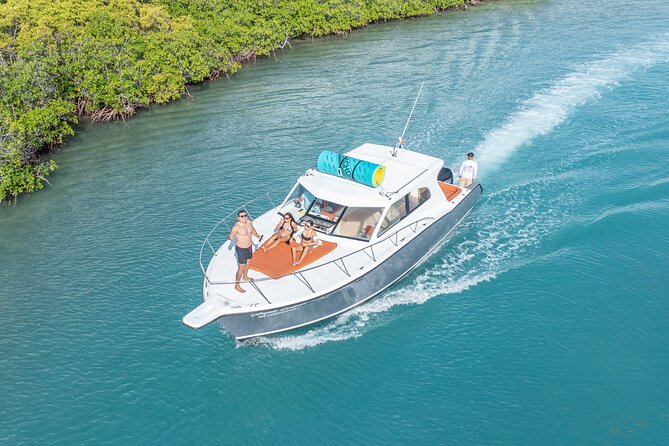 Exclusive Isla Mujeres and Cancun Private Yacht Tour - Onboard comfort: open bar, snacks, and Bluetooth music