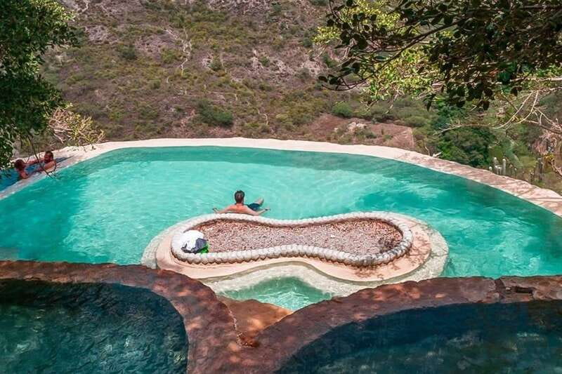 From Mexico City: Tolantongo Caves Small Group Tour - Tolantongo Caves at first glance: cliff pools, caves, and that hot-water calm
