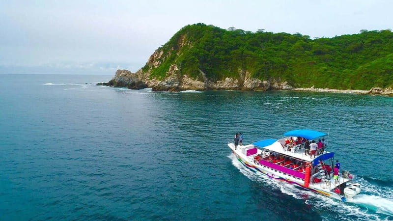 Huatulco: Premium Boat Tour with snorkel experience. - Tangolunda Pickup and Santa Cruz Departure: Timing and How You Get There