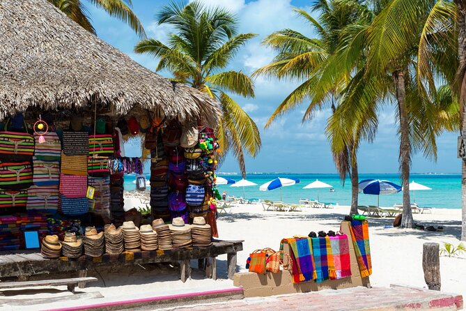Isla Mujeres Catamaran Tour with Snorkel, Open bar and Transport - Open bar and music onboard: fun factor, plus drink expectations
