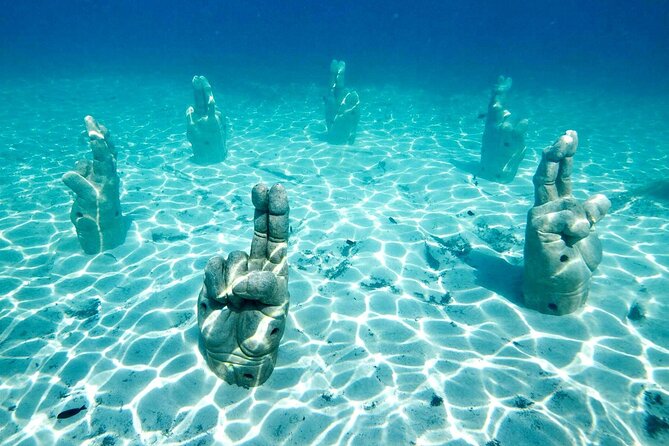Isla Mujeres Tour with Open Bar Food and Snorkeling - Snorkeling at Underwater Statues and Reef: What to Expect