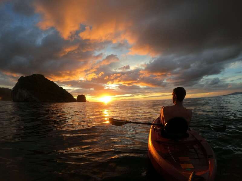 Mismaloya: Los Arcos Bioluminescent Waters Kayak & Cave Tour - Gear-up, lessons, and your paddle start from Mismaloya Beach