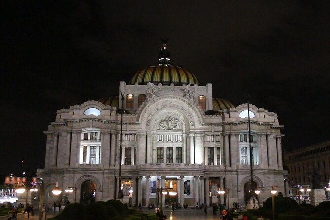 Night Tour of Mexico City Panoramic Ride on a Double-Decker Bus - Benito Juárez monument: the 12 Doric columns and the night glow