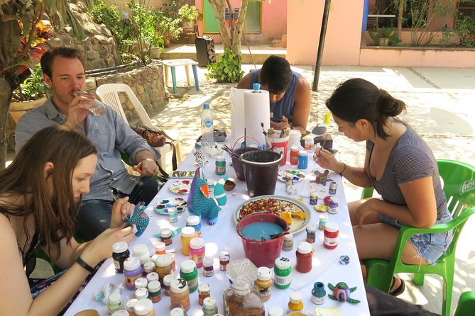 Paint your Alebrije with the Jimenez family. - Choosing your wooden animal and getting ready to paint