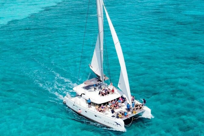 Plus Full Day Catamaran Tour to Isla Mujeres All Inclusive - Isla Mujeres town visit, photos, and souvenir hunting