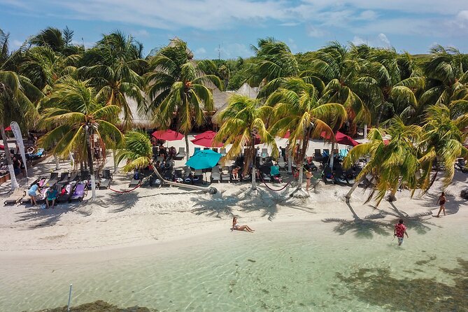 Plus Full Day Catamaran Tour to Isla Mujeres All Inclusive - Crew energy, games, and why guide names matter