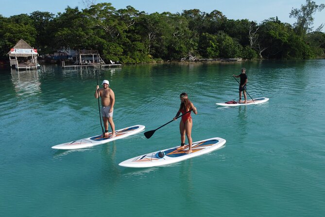 Sunrise on Paddleboard with breakfast in the lagoon of 7 colors - The Black Cenote stop: seeing Bacalar’s color shift in person