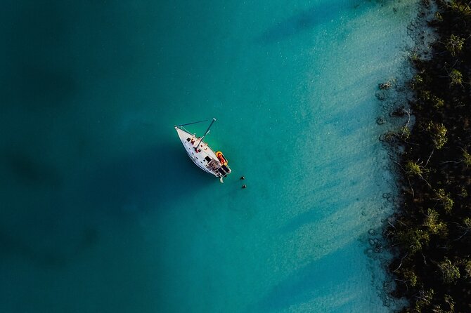 Sunset Sailing Tour in Bacalar with Outdoor Bar and Lunch - Stop 1 at Canal de los Piratas: Turquoise Water, First Drinks, Then Swim