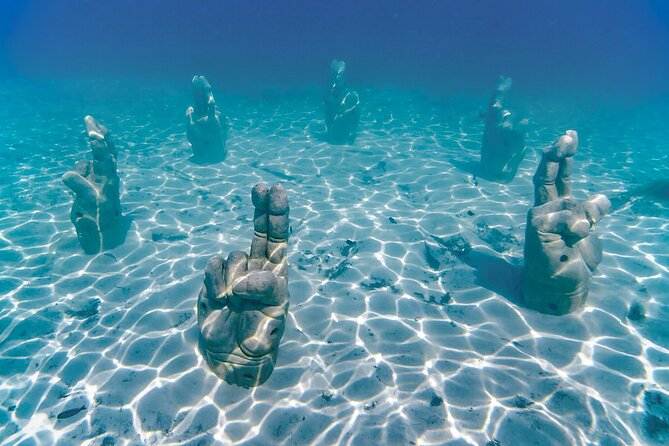 Top Isla Mujeres Catamaran Tour with Snorkel Open Bar and Buffet lunch - Free time on Isla Mujeres: what 90 minutes can realistically do