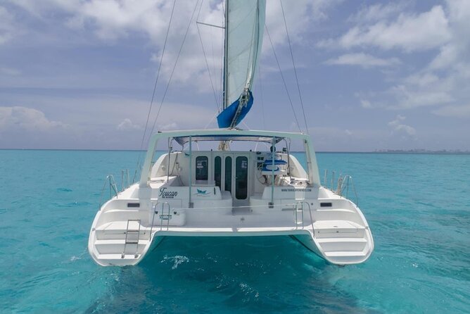 Tour Isla Mujeres Premium - Playa Tortugas first stop: check-in, set sail, and the dock fee