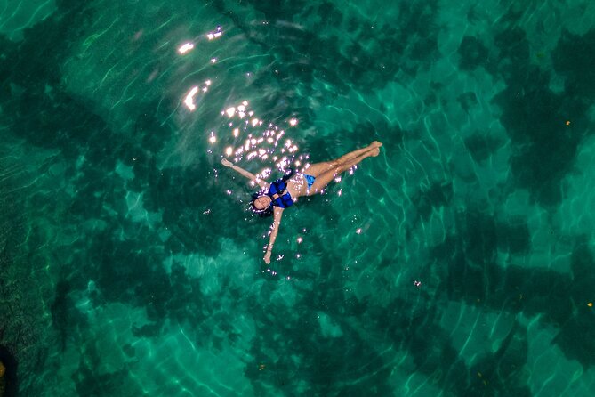 Tulum Guided Tour, Magical Cenote, Lagoon Snorkeling and Beachside Lunch - Yal Ku Lagoon snorkeling: where freshwater meets seawater